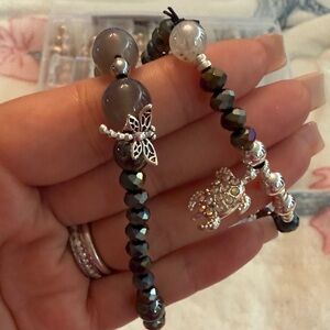 Elegant Black Beaded Bracelet with Dragonfly Charm and turtle charms.